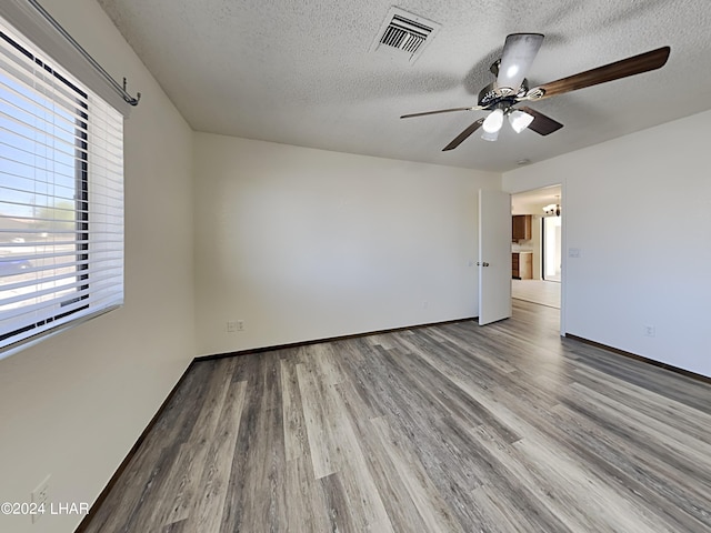 3098 Mcculloch Blvd N, Lake Havasu City, AZ 86403 - unfurnished room featuring a ceiling fan, a textured ceiling, visible vents, and wood finished floors