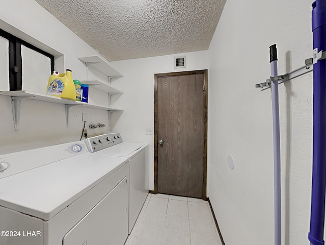 3098 Mcculloch Blvd N, Lake Havasu City, AZ 86403 - clothes washing area with laundry area, a textured ceiling, visible vents, light tile patterned flooring, and washer and dryer