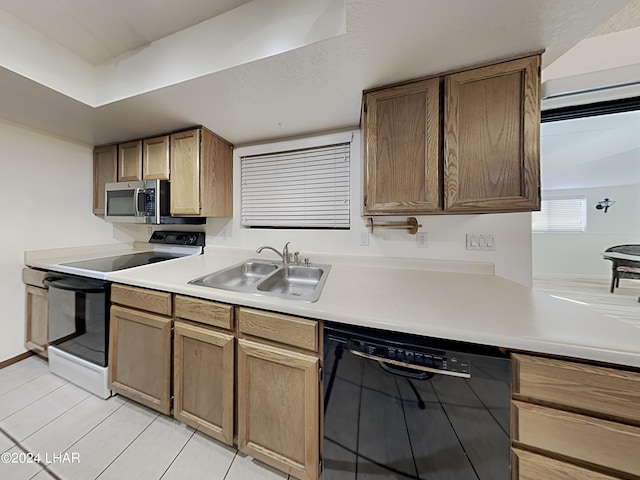 3098 Mcculloch Blvd N, Lake Havasu City, AZ 86403 - kitchen with electric range, dishwasher, a sink, light countertops, and stainless steel microwave