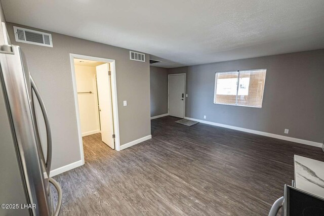 276 Lake Havasu Ave S Unit C31, Lake Havasu City, AZ 86403 - unfurnished living room featuring dark wood-type flooring and baseboards