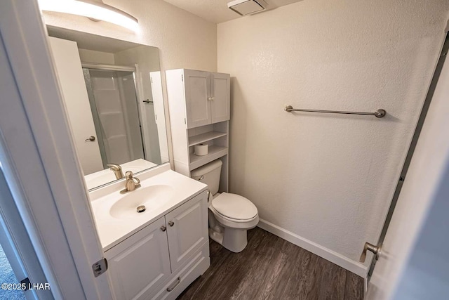 276 Lake Havasu Ave S Unit C31, Lake Havasu City, AZ 86403 - bathroom featuring wood finished floors, baseboards, a textured wall, vanity, and a stall shower