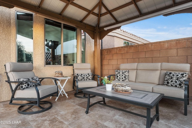 view of patio / terrace with outdoor lounge area and a gazebo