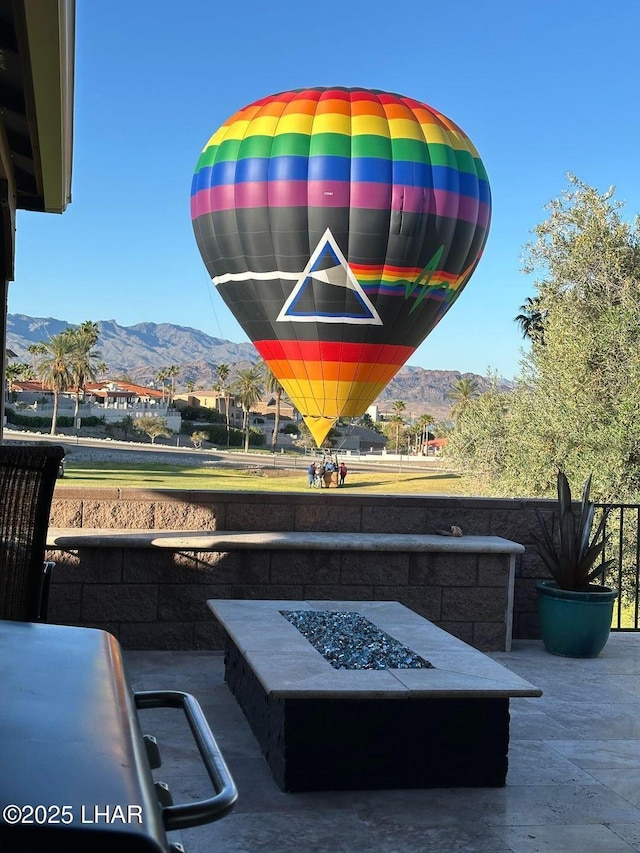 details with a fire pit and a mountain view