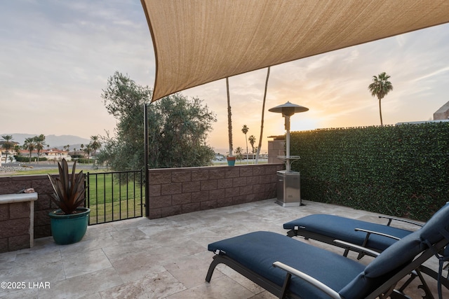 view of patio terrace at dusk