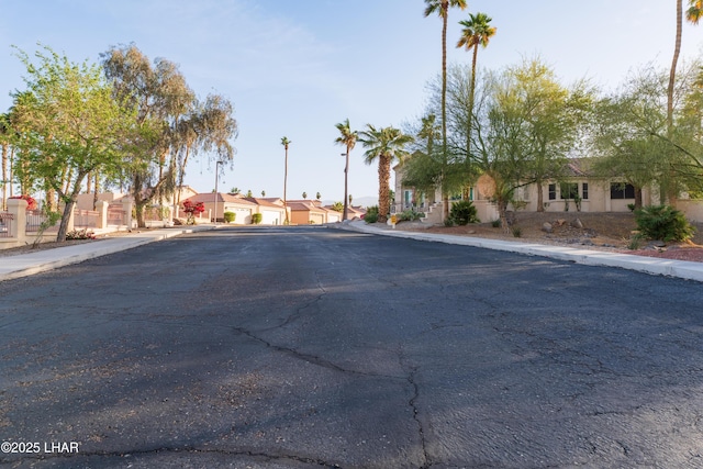 view of street featuring sidewalks, a residential view, and curbs