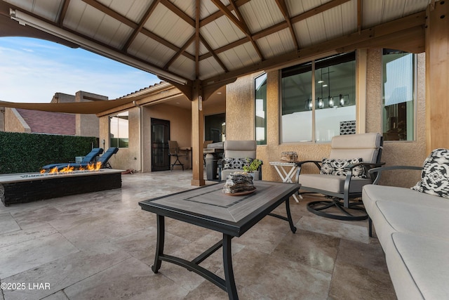 view of patio with an outdoor fire pit