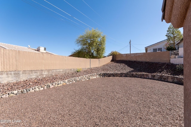 view of yard with a fenced backyard and a patio area