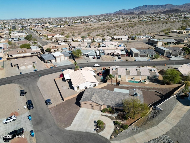 birds eye view of property with a residential view and a mountain view