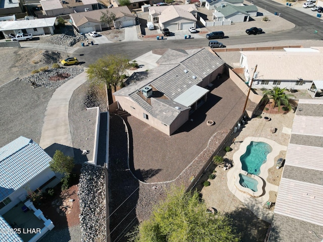 birds eye view of property with a residential view