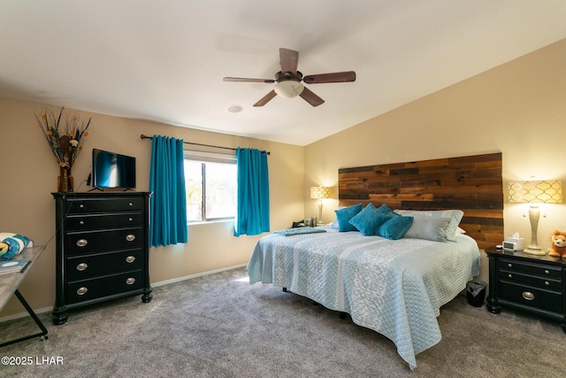 carpeted bedroom featuring baseboards, lofted ceiling, and ceiling fan