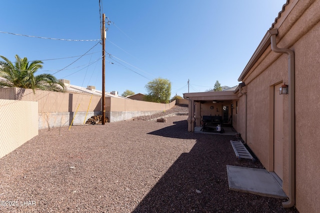 view of yard featuring a fenced backyard and a patio area