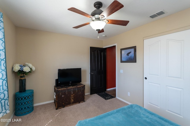 bedroom with a ceiling fan, carpet flooring, baseboards, and visible vents