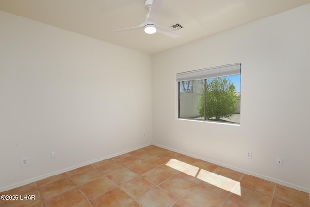 unfurnished room with ceiling fan, baseboards, visible vents, and light tile patterned floors