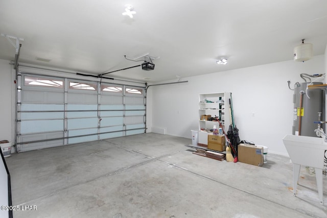 garage featuring electric water heater and a garage door opener