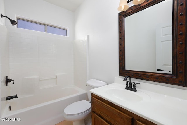 bathroom featuring shower / bathing tub combination, vanity, and toilet