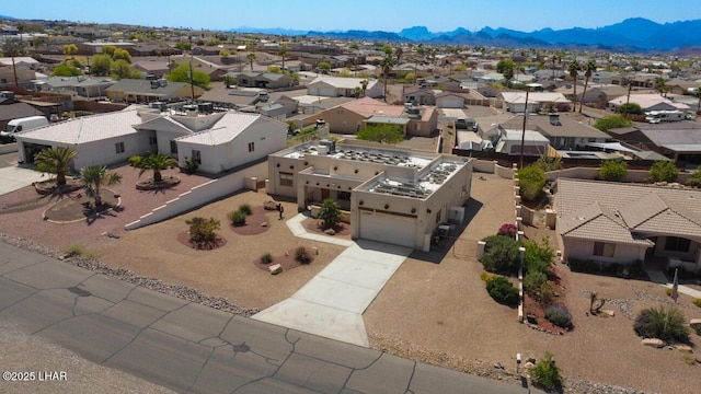 bird's eye view with a mountain view and a residential view