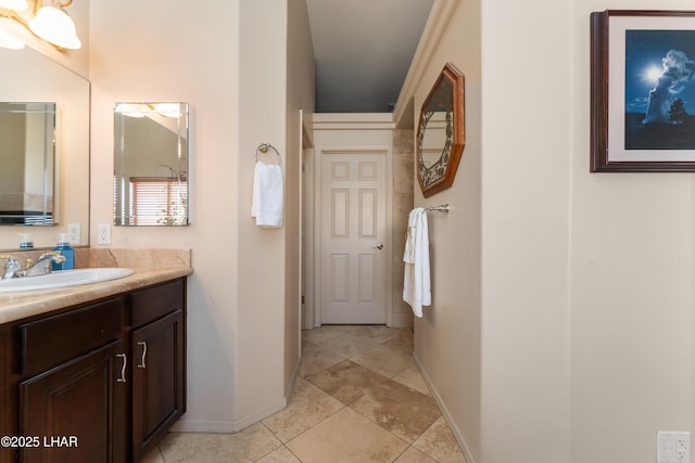 bathroom featuring tile patterned flooring and vanity