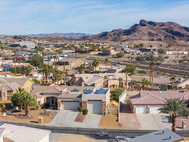 birds eye view of property featuring a mountain view