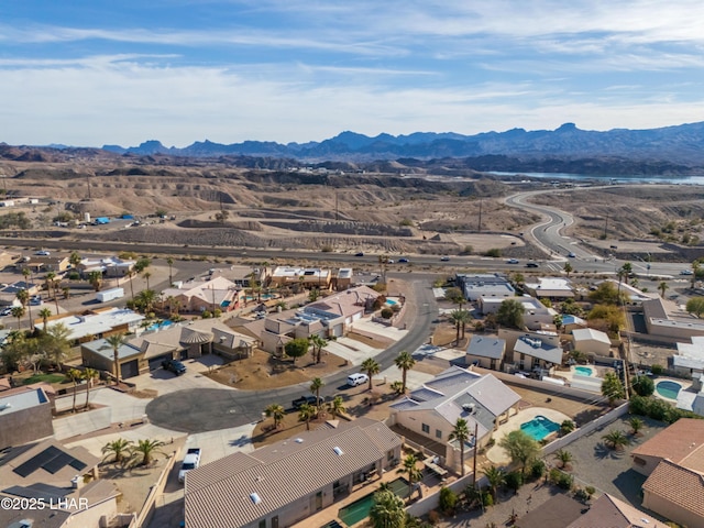 birds eye view of property featuring a mountain view