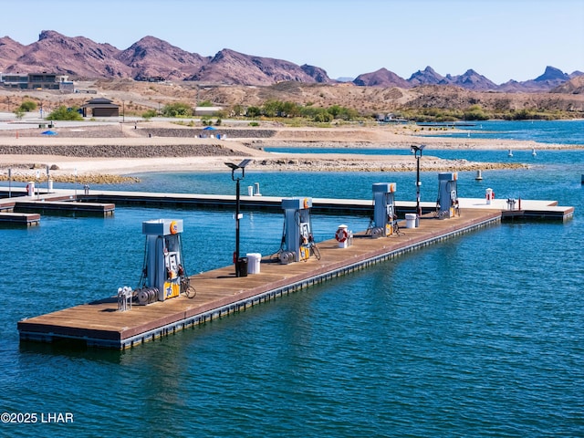 dock area with a water and mountain view