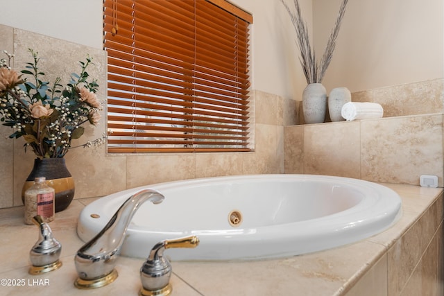 bathroom featuring tiled bath