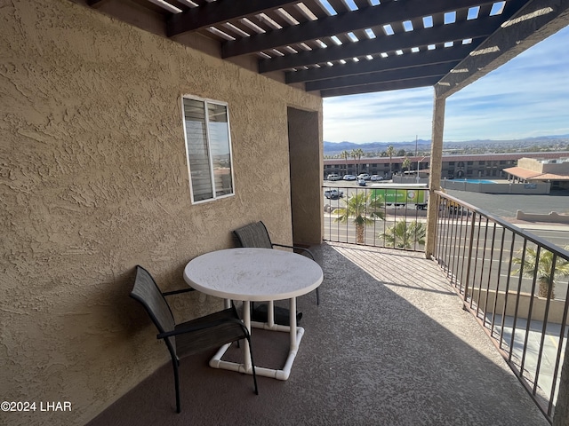 balcony featuring a mountain view