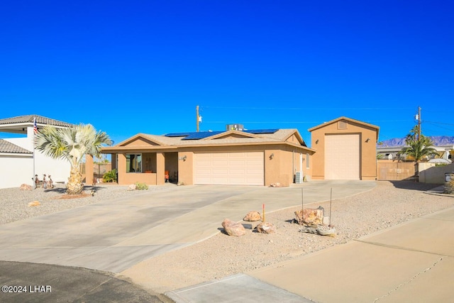 ranch-style house with solar panels