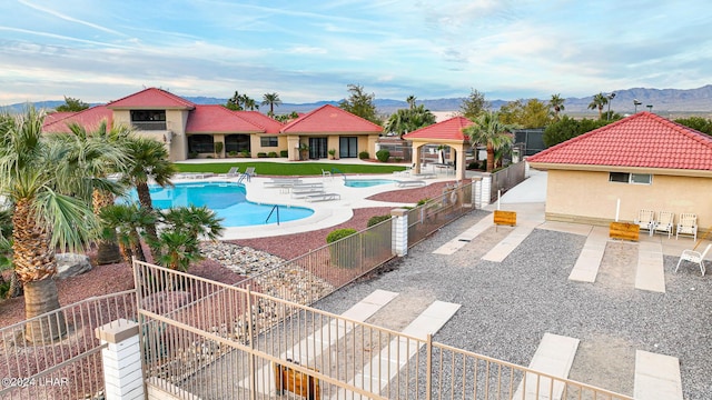 view of pool featuring a gazebo, a mountain view, and a patio