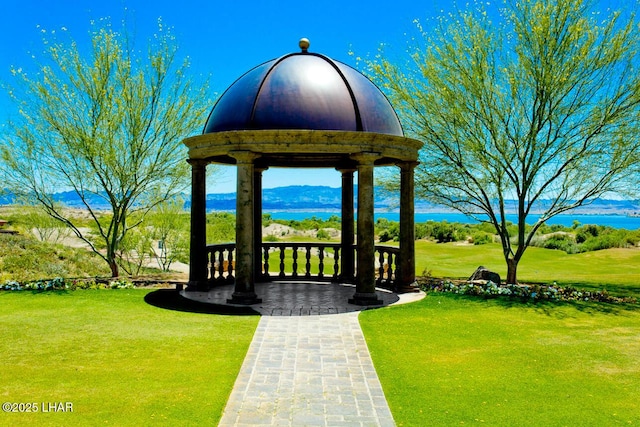view of home's community featuring a yard and a mountain view