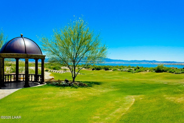 view of yard with a water and mountain view