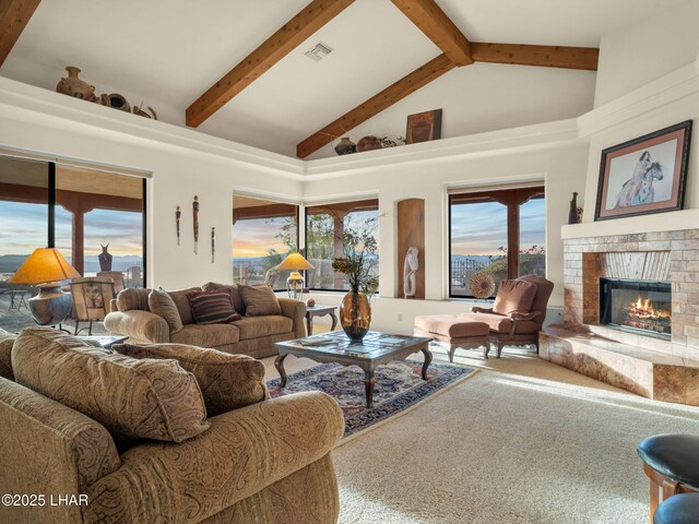 living room with beamed ceiling, carpet floors, high vaulted ceiling, and a brick fireplace