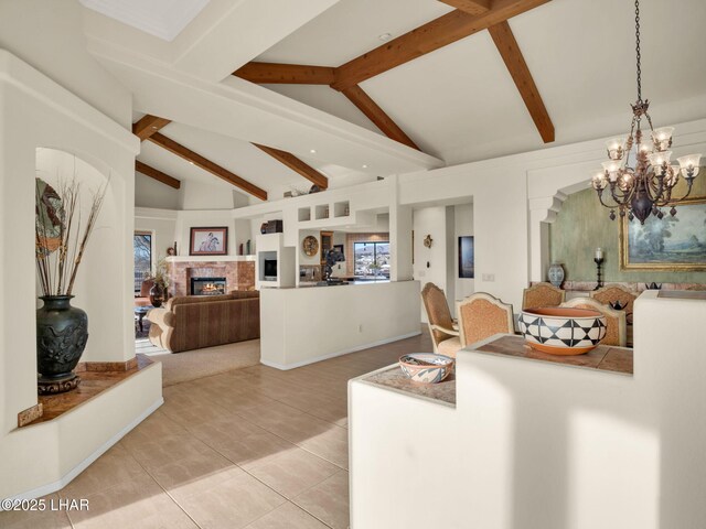 living room with vaulted ceiling with beams, a notable chandelier, and light tile patterned flooring