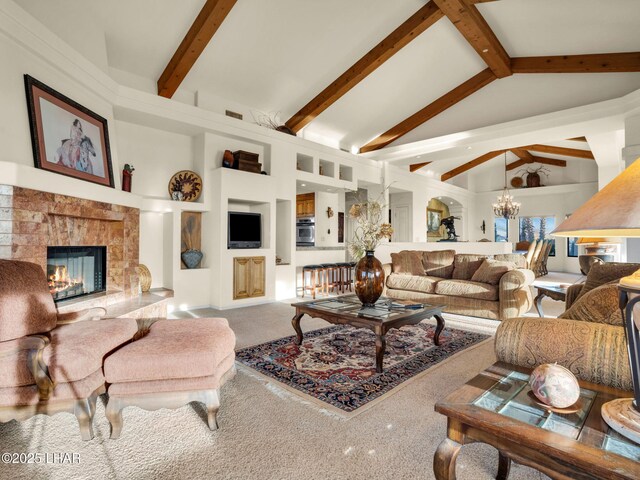 living room featuring an inviting chandelier, high vaulted ceiling, and beamed ceiling