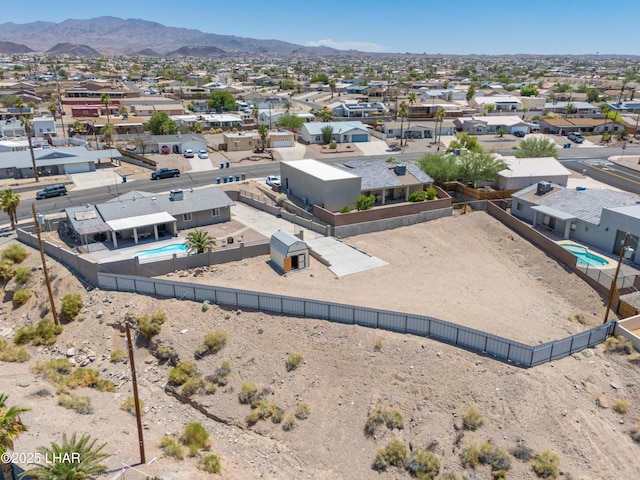 913 Thunderbolt Ave, Lake Havasu City, AZ 86406 - aerial perspective of suburban area with a pool area and a mountainous background