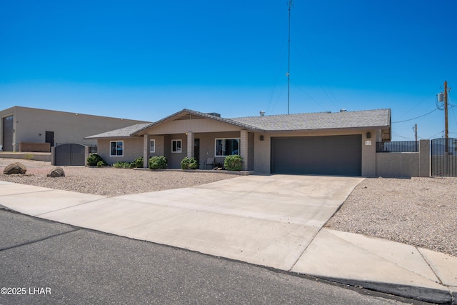913 Thunderbolt Ave, Lake Havasu City, AZ 86406 - ranch-style house with a gate, a garage, stucco siding, and concrete driveway