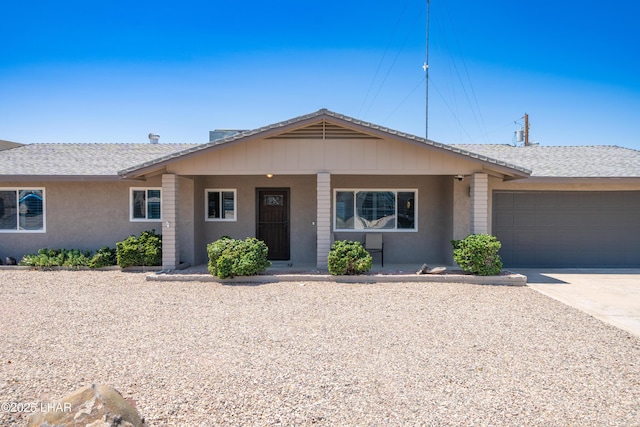 913 Thunderbolt Ave, Lake Havasu City, AZ 86406 - ranch-style house with a garage, covered porch, driveway, and stucco siding