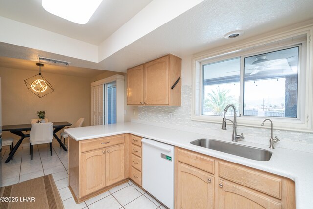 913 Thunderbolt Ave, Lake Havasu City, AZ 86406 - kitchen with dishwasher, light brown cabinets, a peninsula, and light tile patterned flooring