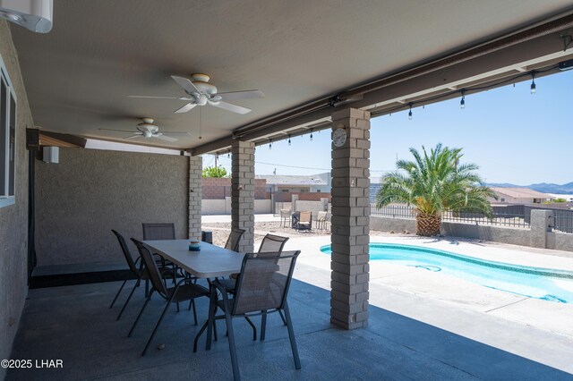 913 Thunderbolt Ave, Lake Havasu City, AZ 86406 - fenced backyard with outdoor dining area, a patio area, and a ceiling fan