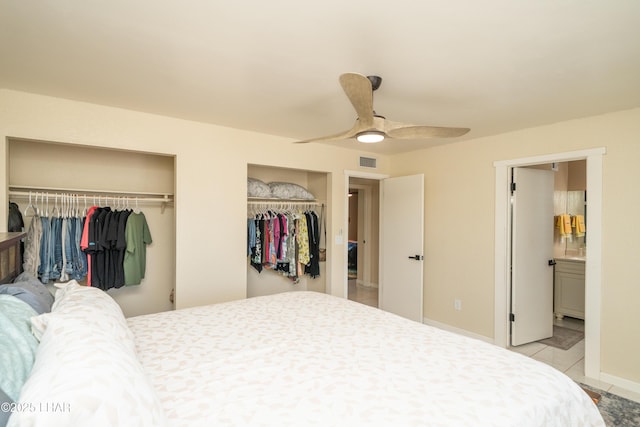 913 Thunderbolt Ave, Lake Havasu City, AZ 86406 - bedroom with multiple closets, light tile patterned flooring, ceiling fan, and connected bathroom