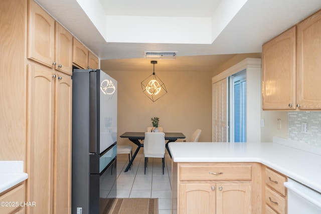 913 Thunderbolt Ave, Lake Havasu City, AZ 86406 - kitchen featuring freestanding refrigerator, light brown cabinetry, a peninsula, white dishwasher, and light tile patterned flooring