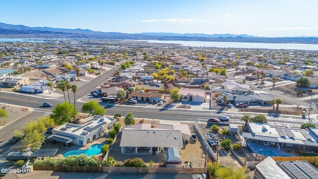 birds eye view of property with a water and mountain view and a residential view