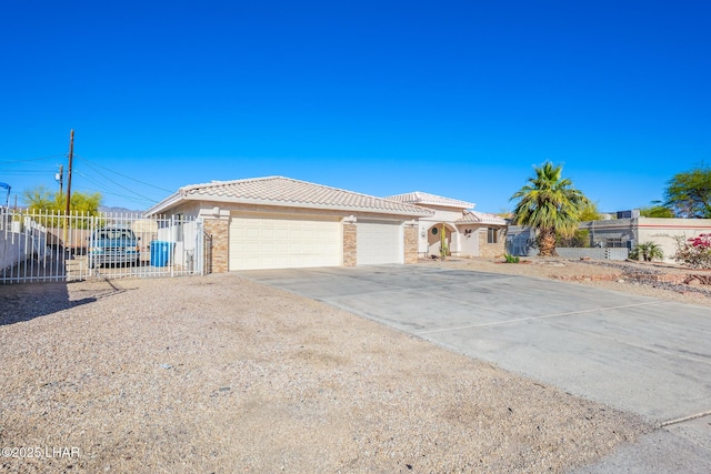 ranch-style house featuring driveway, a tile roof, brick siding, fence, and an attached garage