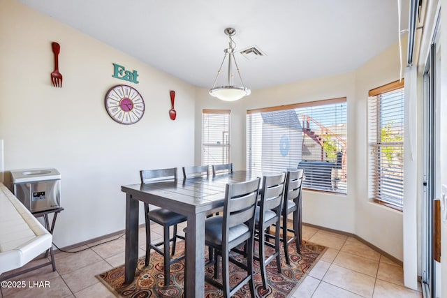 dining room with visible vents, baseboards, and light tile patterned floors