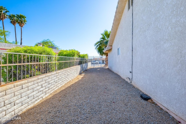 view of home's exterior featuring fence and stucco siding