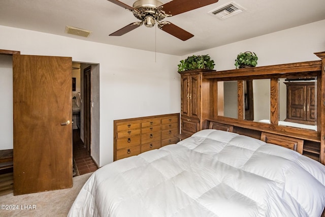 bedroom featuring ceiling fan and light carpet