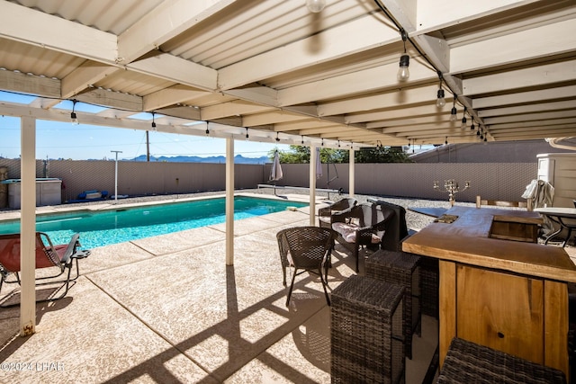 view of swimming pool featuring a patio area