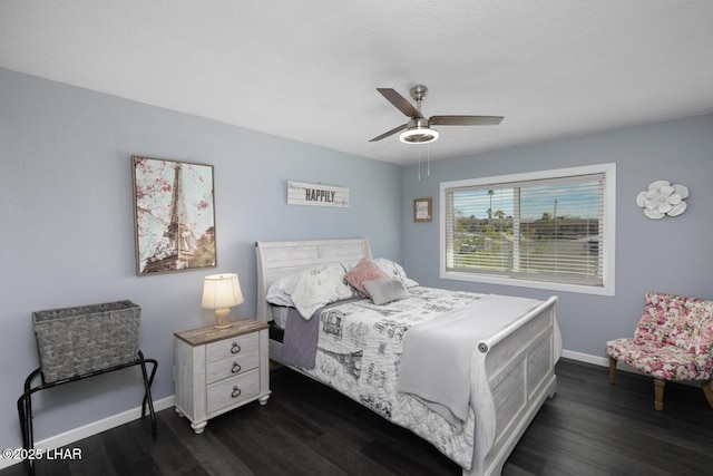 bedroom featuring dark wood-type flooring, baseboards, and a ceiling fan