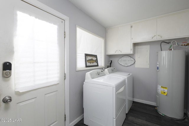 washroom with cabinet space, baseboards, dark wood finished floors, electric water heater, and separate washer and dryer