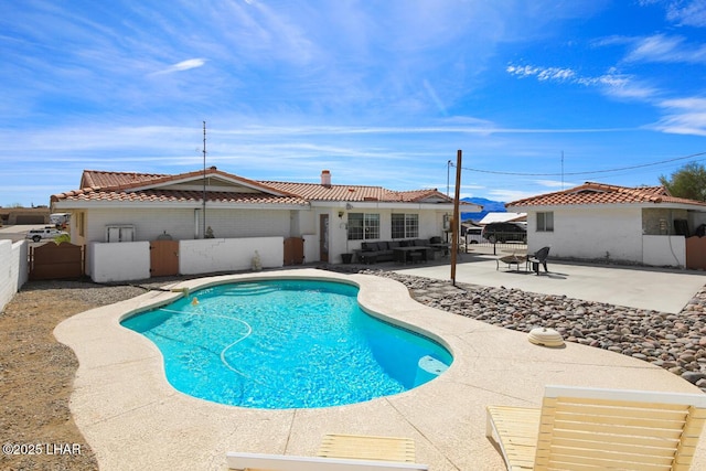 view of swimming pool with a patio, fence private yard, an outdoor living space, and a fenced in pool