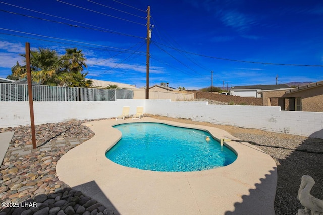 view of pool featuring a fenced in pool and a fenced backyard